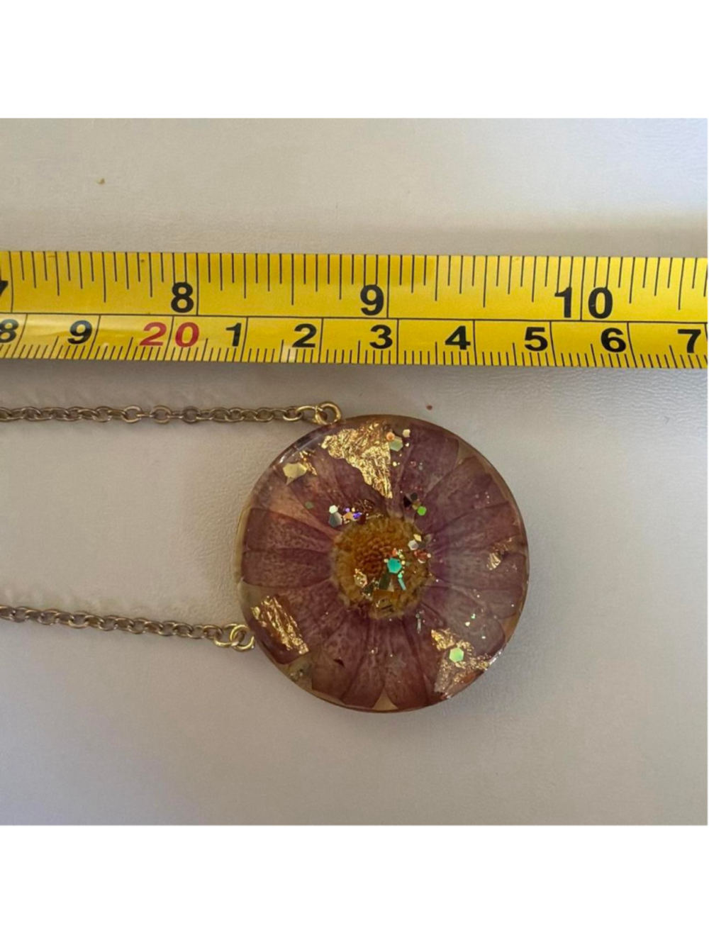 Purple flower in resin necklace